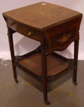 A late Victorian/Edwardian inlaid rosewood lamp table, with two shaped drop leaves, single drawer