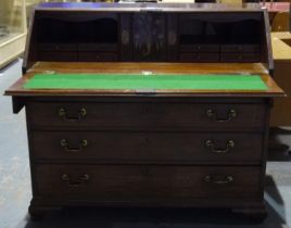 George III mahogany bureau, having an inlaid fitted interior, fall-front and four graduating long