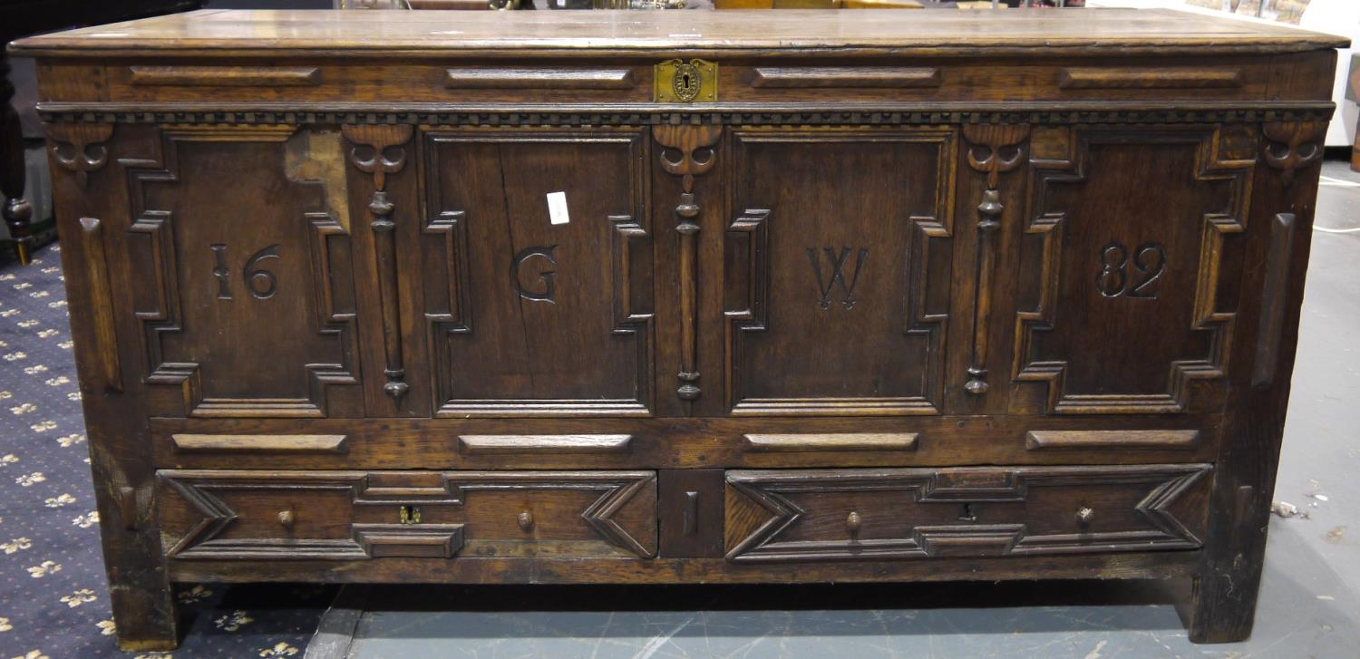 A 17th century English oak dower chest, the four panelled front initialled GW and dated 1682, with