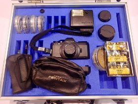 Pentax Auto 110 camera kit including camera body, additional lenses and filters within a fitted