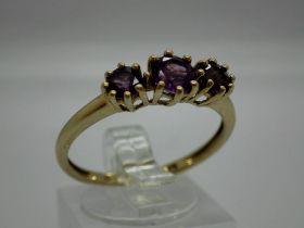 9ct gold trilogy ring set with amethysts, size T/U, 2.1g. UK P&P Group 0 (£6+VAT for the first lot