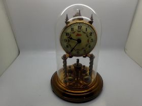 Kerr mantel clock under a glass dome with ceramic dial, not working at lotting. UK P&P Group 2 (£