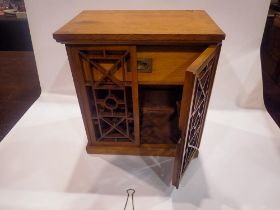 Oak tobacco cabinet with pull out tray for six pipes and a single drawer, 34 x 23 x 36 cm H. UK P&