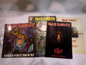 Five Iron Maiden concert programmes, including Somewhere on Tour 1986/87 programme and concert