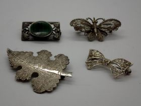 Four silver brooches including a stone set example, largest L: 60 mm. UK P&P Group 1 (£16+VAT for