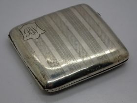 Hallmarked silver cigarette case, Birmingham assay, with faux tortoise shell interior, total 105g.