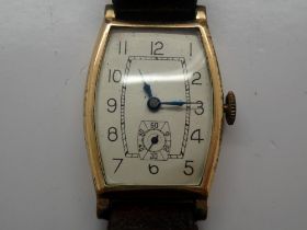 Gents Swiss made 15 jewel wristwatch in a gold filled case with subsidiary seconds dial on a brown