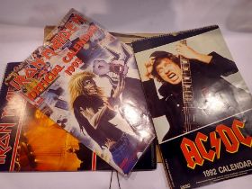 Four rock band calendars, Iron Maiden (2), AC/DC, and The Doors. UK P&P Group 2 (£20+VAT for the