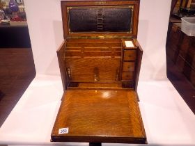 Victorian oak writing slope with tooled leather fitted interior, appears in excellent condition,