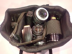 Olympus OM20 outfit in a carry bag. UK P&P Group 2 (£20+VAT for the first lot and £4+VAT for