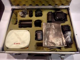 Canon T90 35mm SLR camera kit, including additional lenses and accessories in a fitted case. UK P&