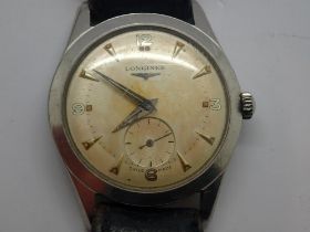 LONGINES: gents manual wind wristwatch with subsidiary seconds dial on a black leather strap,