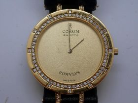 CORUM ROMULUS: 18ct gold cased wristwatch with diamond set bezel on a black leather strap, not