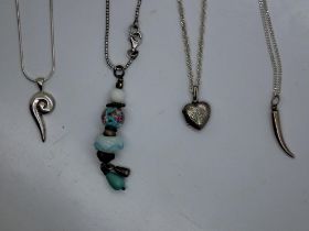 Four silver pendant necklaces, largest chain L: 50 cm. UK P&P Group 1 (£16+VAT for the first lot and