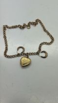 9ct gold neck chain with a 9ct gold back and front pendant locket and a pair of 9ct gold earrings