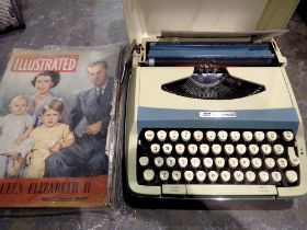 Smith Corona portable typewriter with instructions and royal commemorative ephemera. Not available