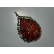 Oversized silver mounted carved and polished Baltic amber pendant, L: 90 mm, 60g. UK P&P Group 0 (£