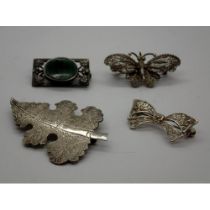 Four silver brooches including a stone set example, largest L: 60 mm. UK P&P Group 1 (£16+VAT for