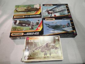 Five 1/72 scale Matchbox aircraft kits, Harrier, P47D, Spitfire, Gladiator and Huey Cobra, all