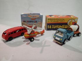 Two boxed tinplate vehicles, push along, one pick up truck with cement mixer trailer, and one red