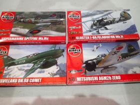 Four 1/72 scale Airfix aircraft kits, Comet, Zero, Gladiator, and Spitfire, all appear factory
