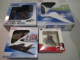 Four diecast aircrafts, 1/200 scale Vulcan and Lightening, 1/144 scale Nighthawk, and 1/72 scale