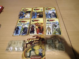 Six Indiana Jones figures, including six replica Kenner in reprint packets, and two packs of ten