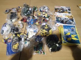 Small quantity of Lego, some in small sealed packets, includes Star wars example, contents