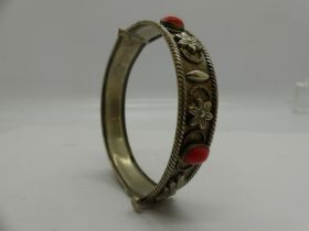 White metal bangle with coral cabochons, D: 70 mm. UK P&P Group 0 (£6+VAT for the first lot and £1+