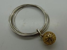 White metal bangle with gold plated circular charm, D: 70mm. UK P&P Group 0 (£6+VAT for the first
