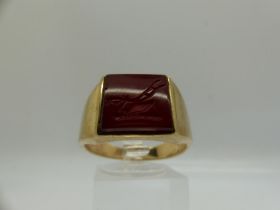 9ct gold signet ring, set with a carved carnelian intaglio displaying a plough, size U, 7.8g. UK P&P