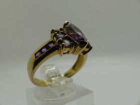 9ct gold cluster ring set with amethysts, size N/O, 3.2g. UK P&P Group 0 (£6+VAT for the first lot