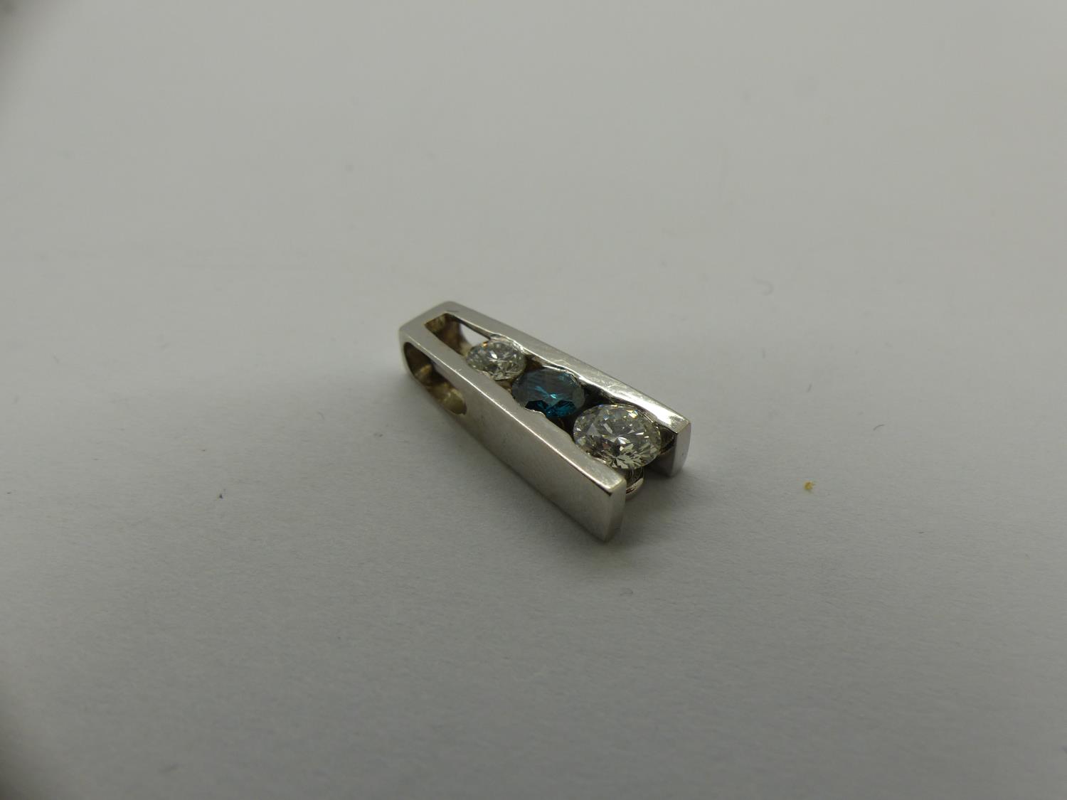 Unmarked white gold pendant set with blue topaz and diamonds, H: 20 mm, 2.7g. UK P&P Group 0 (£6+VAT - Image 3 of 3