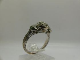 14ct yellow gold diamond ring with central stone (0.25ct) flanked by further diamonds and an