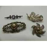 Four silver brooches, including a stone set example, largest L: 50 mm. UK P&P Group 1 (£16+VAT for