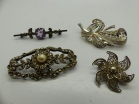 Four silver brooches, including a stone set example, largest L: 50 mm. UK P&P Group 1 (£16+VAT for