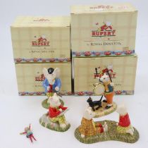 Four boxed Royal Doulton Rupert the Bear figurines, largest H: 13cm, no cracks or chips. UK P&P