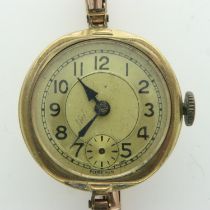 9ct gold ladies wristwatch on 9ct gold expanding bracelet, 16.1g, working at lotting up. UK P&P