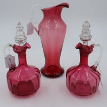 Two cranberry glass decanters and jug (H: 31 cm) no chips or cracks. Not available for in-house P&P