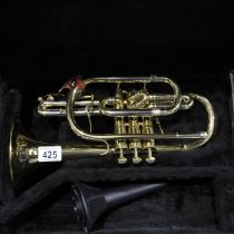 Sterling brass cornet within a fitted case, lacking mouth piece. Maker: Sterling of Great Britain,