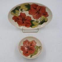 Two pieces of Moorcroft in the Hibiscus pattern, no cracks or chips, L: 23 cm. UK P&P Group 2 (£20+