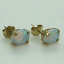 Presumed 9ct gold mounted pair of opal stud earrings. UK P&P Group 0 (£6+VAT for the first lot