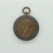 1905 Naval Shipping & Fisheries Exhibition fob, formed from copper and oak salvaged from Nelsons