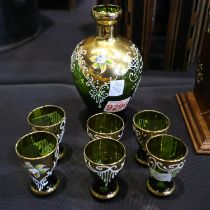 Bohemian green glass liquor decanter (H: 17 cm), and six glasses heavily decorated with gilt