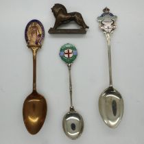 1924 British Empire Exhibition (Wembley): three enamelled souvenir teaspoons, and a cast lead