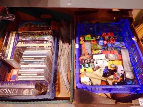 Three trays of miscellaneous items to include toy cars, model rail track etc. Not available for in-