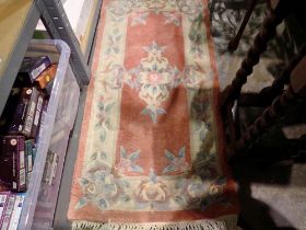 Small peach Chinese floral woollen rug. Not available for in-house P&P
