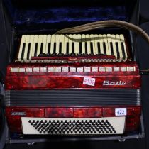 Clansman accordion in red within a fitted case. UK P&P Group 3 (£30+VAT for the first lot and £8+VAT