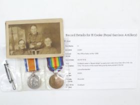 British WWI medal pair, Wound Stripe and Photograph awarded to: 63252 Bombardier H Cooke Royal