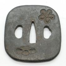 Japanese iron tsuba with decoration in relief and signed. UK P&P Group 1 (£16+VAT for the first